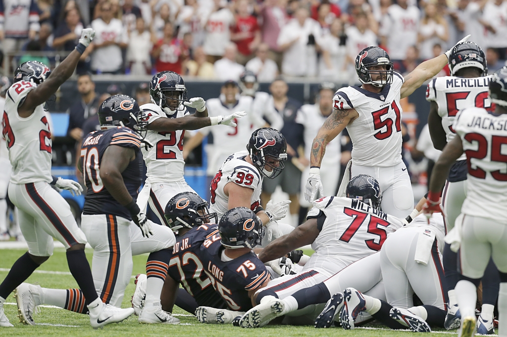 The Houston Texans signal that they stopped the Chicago Bears on fourth and short in the first quarter at NRG Stadium