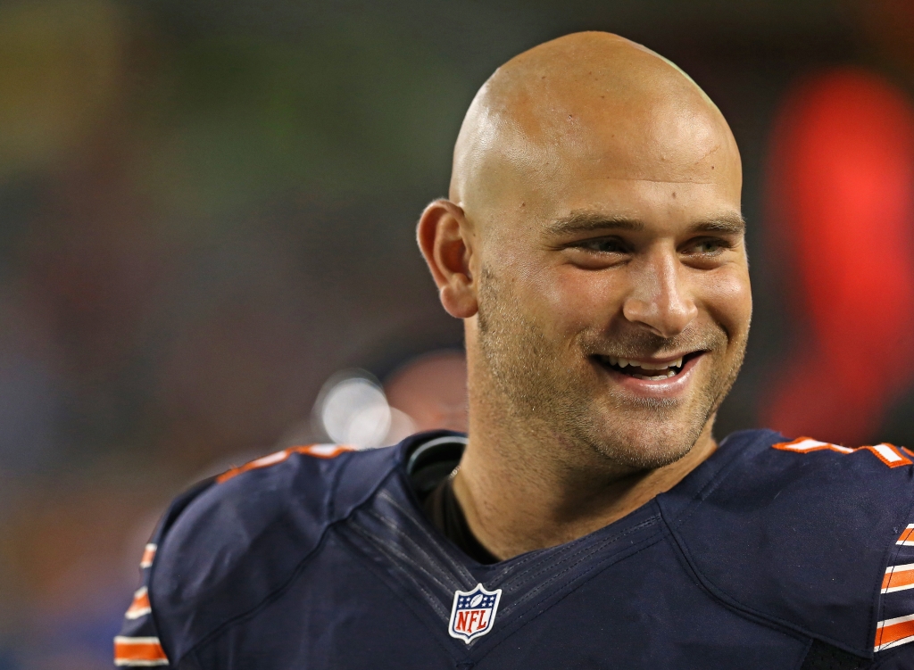 CHICAGO IL- AUGUST 15 Kyle Long #75 of the Chicago Bears smiles at a teammate on the sidelines during a game against the San Diego Chargers at Soldier Field