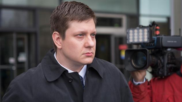 Chicago police officer Jason Van Dyke leaves the Criminal Courts Building after pleading not guilty to first-degree murder charges related to the shooting death of 17-year-old Laquan Mc Donald