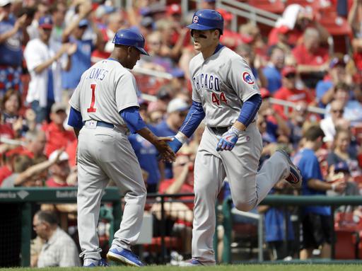 Chicago’s Anthony Rizzo right greets third-base coach Gary Jones after one of his two home runs