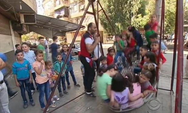 Children playing outside in Syria during the cease-fire.                CBS News