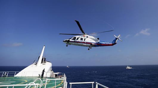 Nearly 300 armed Chinese police officers and soldiers took part in an emergency drill near the Xisha Islands in the South China Sea