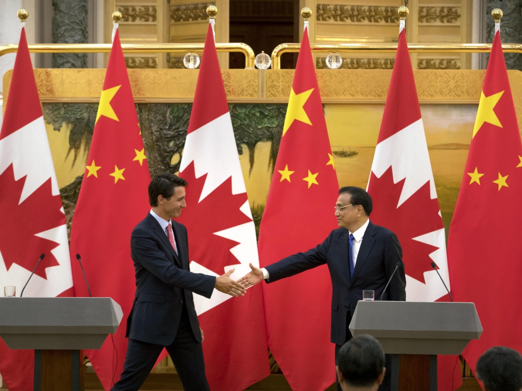 Canadian Prime Minister Justin Trudeau and China's Premier Li Keqiang wrap up a joint press conference in Beijing on Aug. 31. Canada and China have agreed to discuss the possibility of an extradition treaty