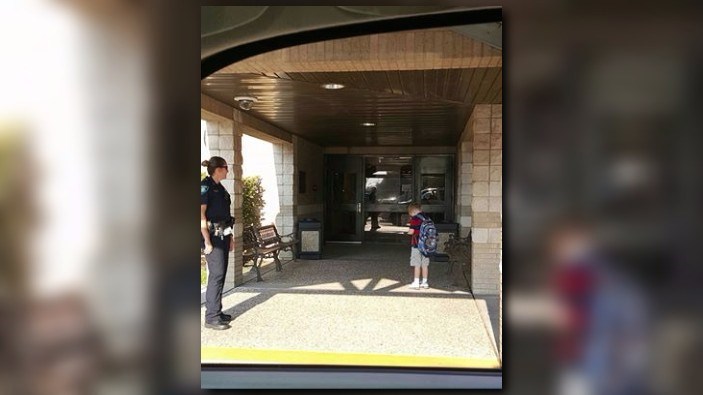 Boy running late for school, stops for the Pledge of Allegiance and a prayer