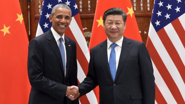 US President Barack Obama and Chinese President Xi Jinping shake hands before their meeting at the West Lake State Guest