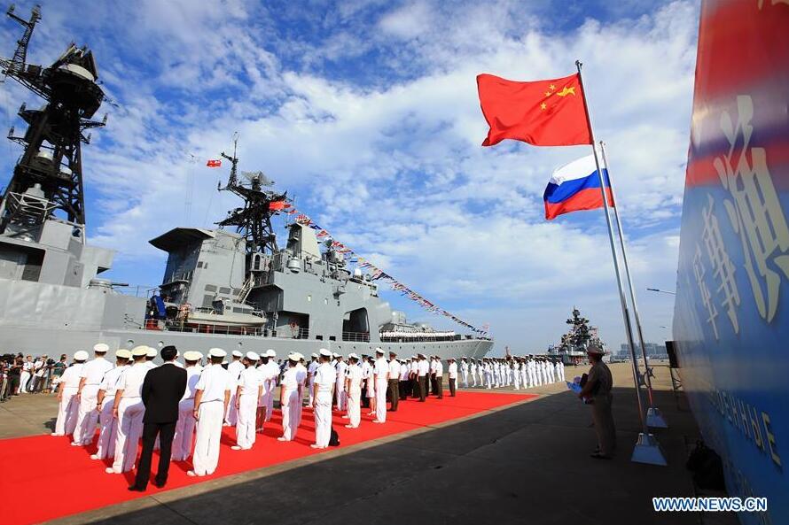 Officers and soldiers of Chinese Navy hold a welcome ceremony as a Russian fleet arrive at a port in Zhanjiang south China