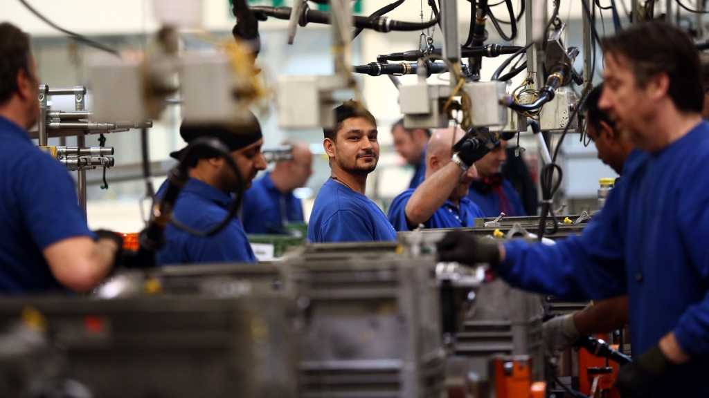 Employees work on an engine production line at a Ford factory in Dagenham England. Many American firms based in the U.K. are concerned Brexit will adversely impact their businesses