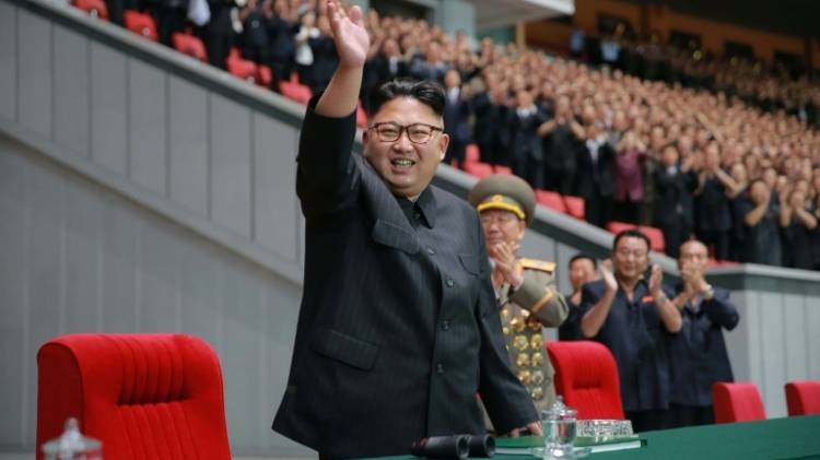 North Korean leader Kim Jong Un waves while attending a torchlight gala of members of the youth vanguard 'Let the Youth Power March forward Following the Party!&#039, at the May Day Stadium in Pyongyang