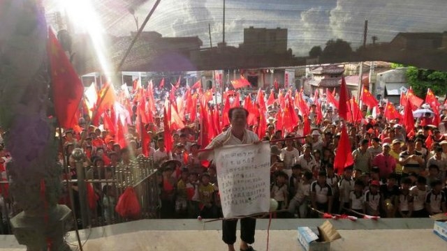 China police fire rubber bullets as 'democracy&#039 village erupts after arrests