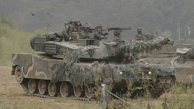 A South Korean army's K1 tank moves during an annual exercise in Paju South Korea near the border with North Korea Sunday Sept. 11 2016. The U.N. Security Council is strongly condemning North Korea's latest nuclear test and says it will sta