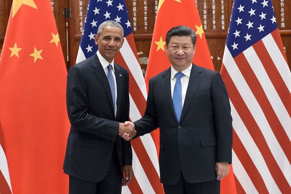 Chinese President Xi Jinping shakes hands with US President Barack Obama ahead of G20 Summit