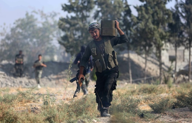 A fighter from the Jaish al Islam, the foremost rebel group in Damascus province which fiercely opposes both the Syrian regime and the Islamic S