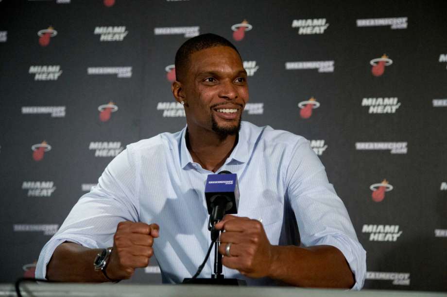 Miami Heat forward Chris Bosh gestures as he speaks during a news conference in Miami. The Heat forward who had each of his last two seasons halted by blood clots that were discovered at the All Star break said