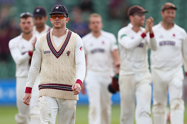 Chris Rogers scored a hundred in each innings for Somerset to keep them in the hunt for county title