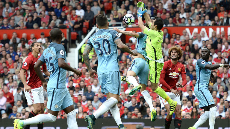 Claudio Bravo fumbles the ball as he collides with team-mate John Stones