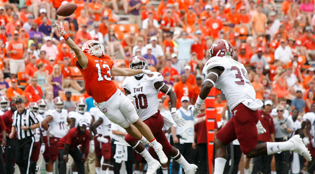 CLEMSON SC- SEPTEMBER 10 Hunter Renfrow #13 of the Clemson Tigers reaches for a pass during the game against the Troy Trojans at Memorial Stadium