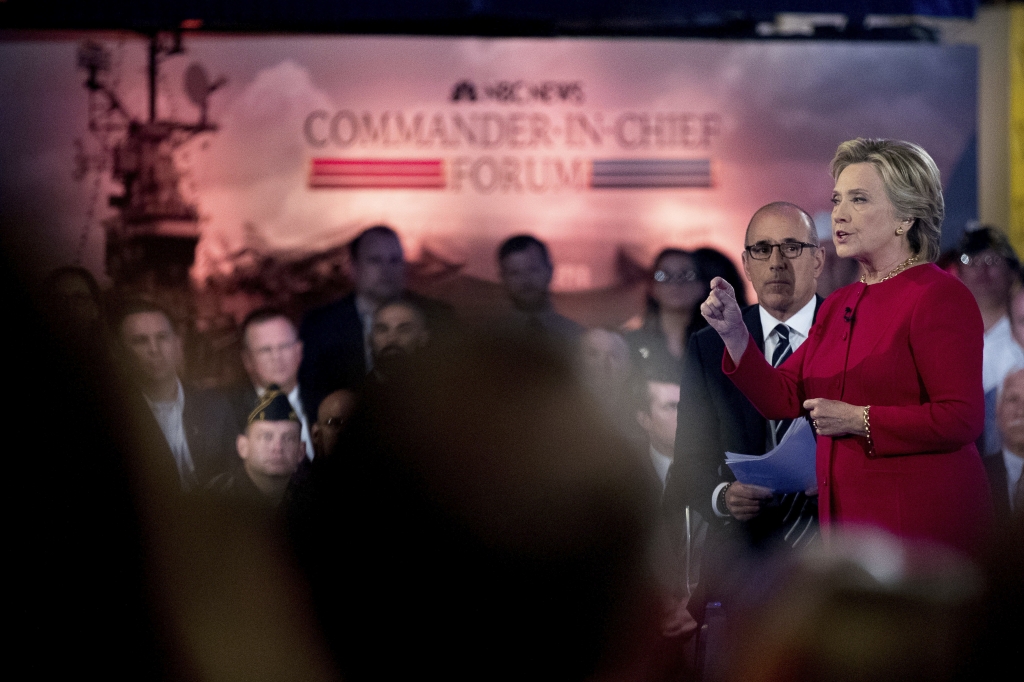 Democratic presidential candidate Hillary Clinton accompanied by'Today show co-anchor Matt Lauer second from right speaks at the NBC Commander-In-Chief Forum held at the Intrepid Sea Air and Space museum aboard the decommissioned aircraft carrier In