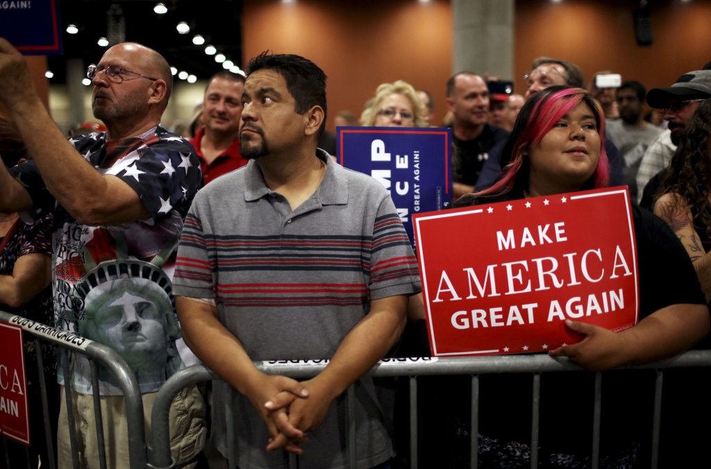 TRUMP IMMIG 23-117 Supporters of Donald Trump the Republican presidential nominee attend a campaign event Wednesday in Phoenix Ariz. focused on immigration policy