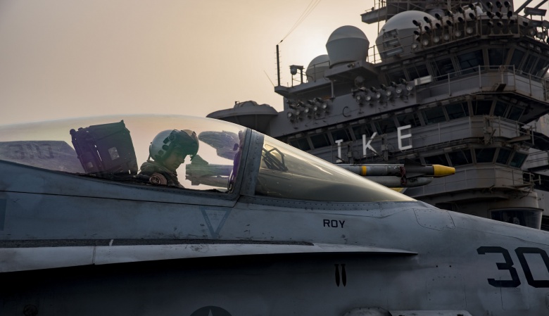 A pilot awaits in an F  A-18C Hornet taxis across the flight deck of the aircraft carrier USS Dwight D. Eisenhower. Flickr  U.S. Navy