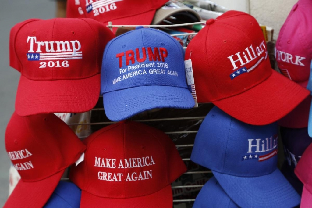 Hats displaying support for Republican presidential candidate Donald Trump and his Democratic opponent Hillary Clinton are displayed by a sidewalk vendor Tuesday Aug. 16 2016 in New York