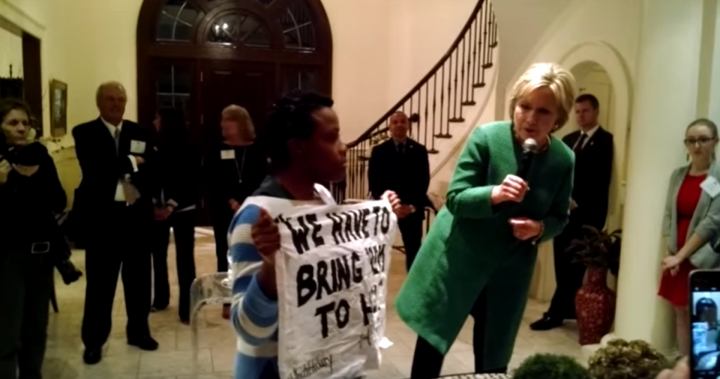 Still image from video of Black Lives Matter protester confronting Hillary Clinton about her'superpredator comment. Source https