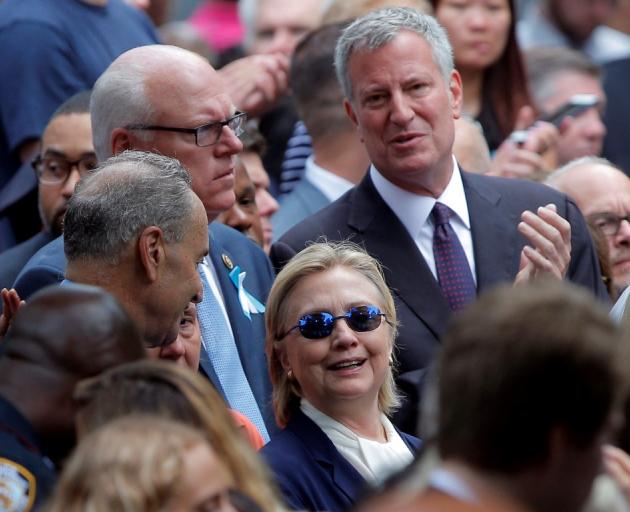 Hillary Clinton and New York Mayor Bill de Blasio attend ceremonies to mark the 15th