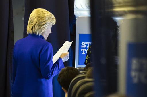 Democratic presidential candidate Hillary Clinton meets with members of her staff onboard her campaign plane en route to Westchester County Airport in White Plains N.Y. from Florida Wednesday Sept. 21 2016