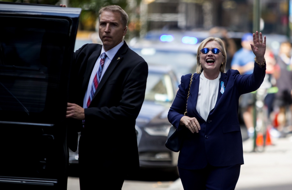 SEPT11 ANNIVERSARY 32-55 Hillary Clinton departs from her daughter Chelsea Clinton's apartment a few hours after leaving a ceremony marking the 15th anniversary of the 9/11 terrorist attacks early in New York on Sunday