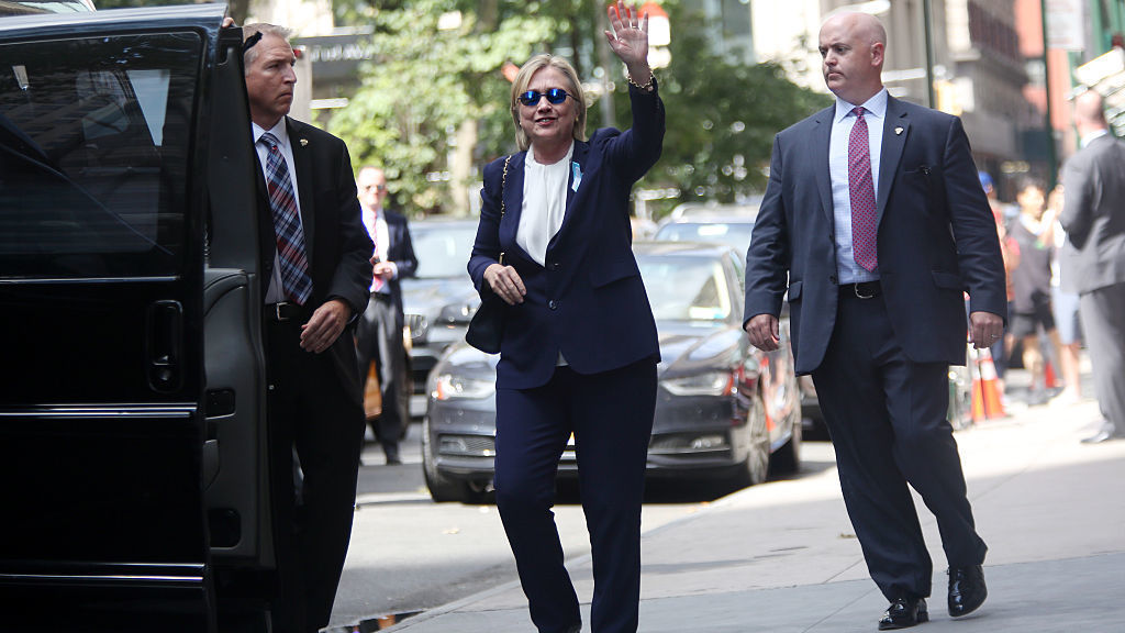 Hillary Clinton exits her daughter Chelsea Clinton's apartment on Sunday after she became sick at a Sept. 11 memorial service. Diagnosed with pneumonia she had taken several days off the campaign trail to recover