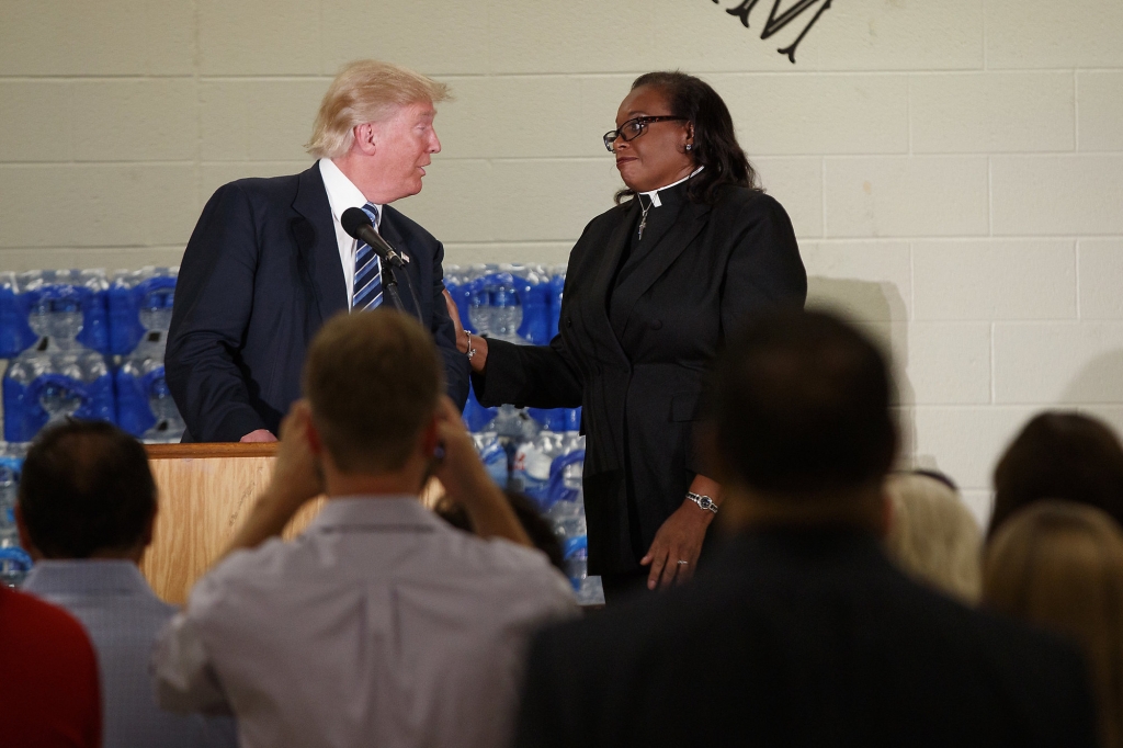 Rev. Faith Green Timmons interrupts Republican presidential candidate Donald Trump as he spoke during a visit to Bethel United Methodist Church Wednesday Sept. 14 2016 in Flint Mich. Timmons asked that Trump not deliver a political speech and keep