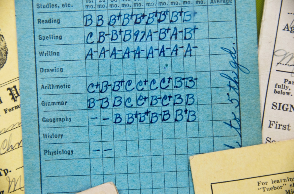 Close up of an old school report card from an elementary grade