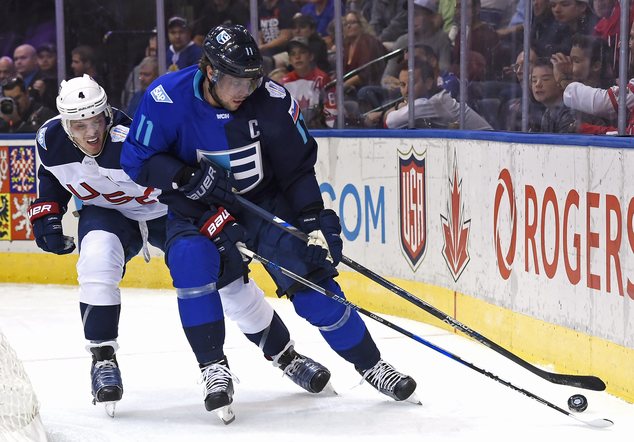 Team Europe's Anze Kopitar right battles with United States John Carlson during the first period of a World Cup of Hockey game Saturday Sept. 17 2016