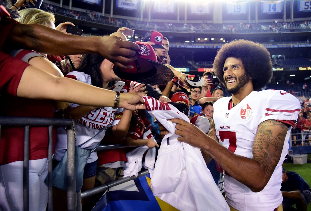 Colin Kaepernick of the San Francisco 49ers signs autographs for fans on Sept. 1 2016 in San Diego California