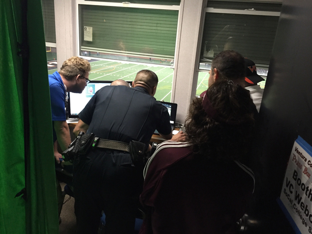 Sgt. Mike Pallotto of the Ventura College police department reviews game footage to determine whether a Mt. St. Antonio College player punched a referee duri