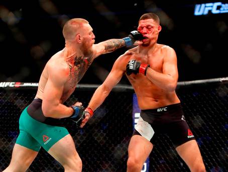 Conor Mc Gregor lands a punch on Nate Diaz