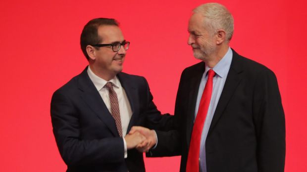 Jeremy Corbyn MP shakes hands with Owen Smith MP as they arrive to hear the result for the new leader of the