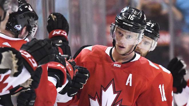 Team Canada's Jonathan Toews celebrates his second goal of the game against Team Europe with teammates on the bench during second period World Cup of Hockey action in Toronto on Wednesday