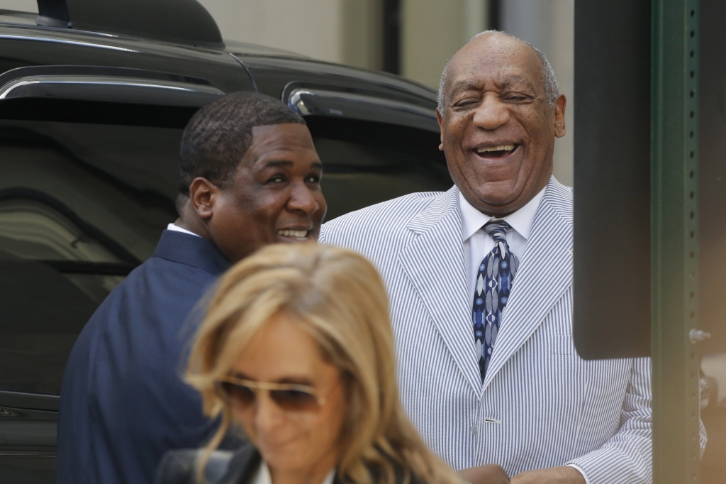 Bill Cosby laughing as he arrives at court for sex assault hearing