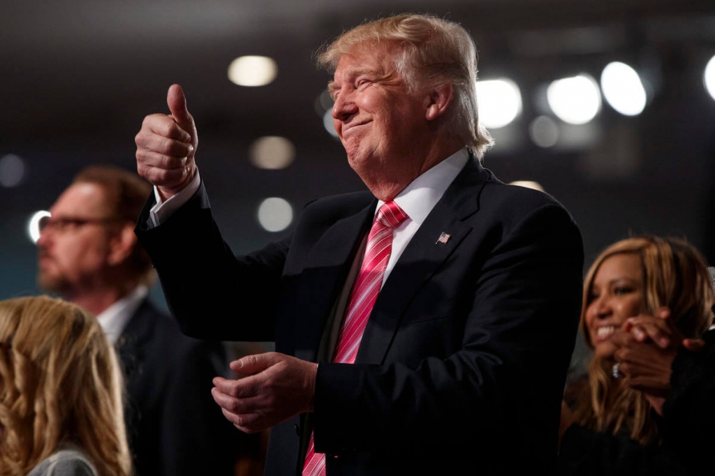 GOP nominee Donald Trump visits a Baptist church in Detroit yesterday calling for a ‘civil rights agenda of our time