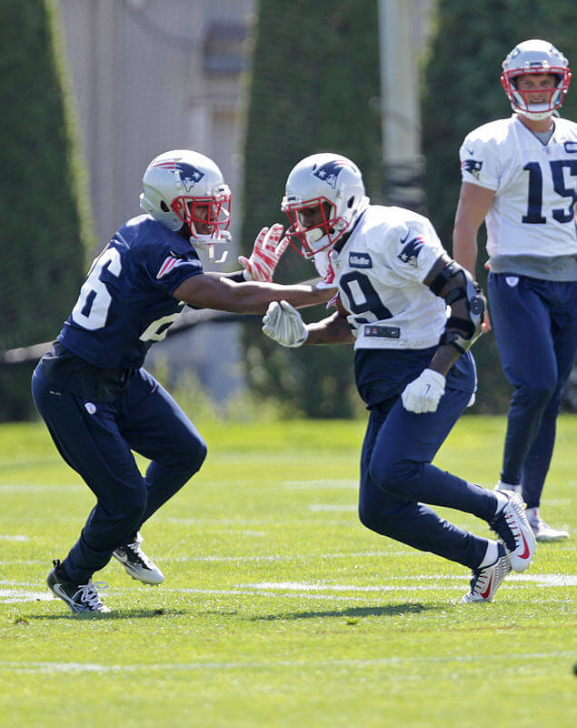 Credit John Wilcox        CAN’T KEEP HIM AWAY Malcolm Mitchell works against cornerback Logan Ryan during a drill in practice yesterday in Foxboro