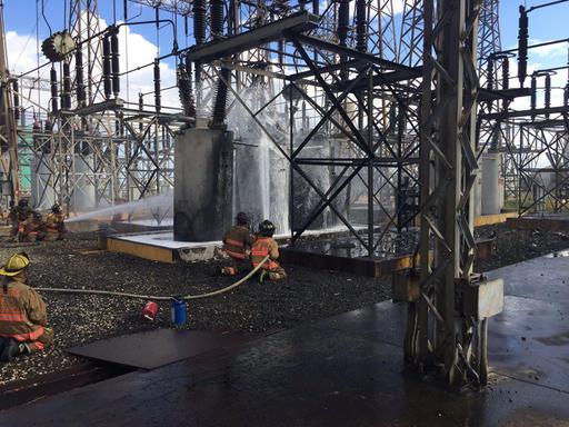 Rico's state emergency and disaster agency AEMEAD firefighters work to put out a fire at the power plant in Salinas Puerto Rico Wednesday Sept. 20 2016. Power went out abruptly Wednesday afternoon following a fire