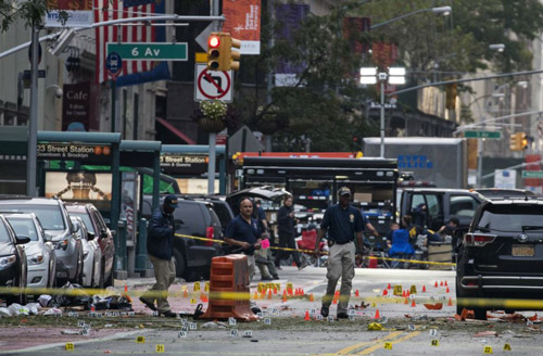 Crime scene investigators work at the scene of Saturdays explosion in Manhattans Chelsea neighborhood in New York on Sept. 18 2016. /AP