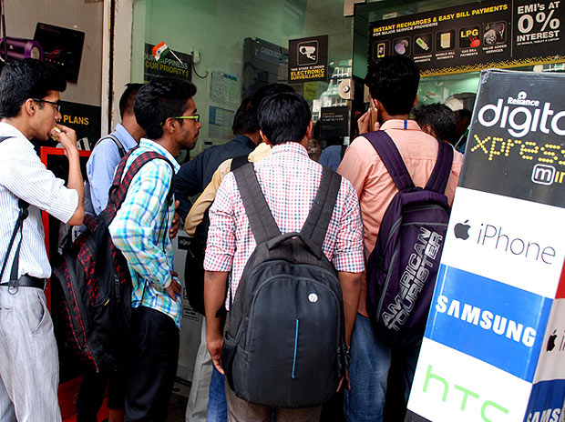 Crowd outside a Reliance Digital Express store to get Reliance Jio SIM cards in New Delhi on Monday