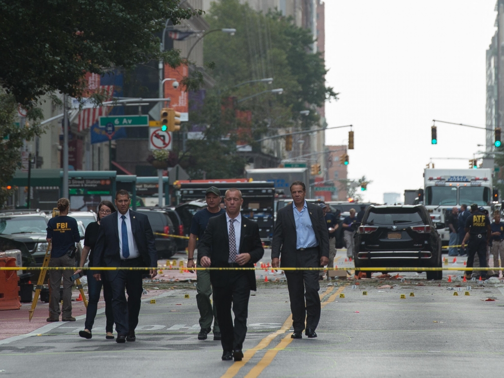 New York Governor Andrew Cuomo visits the scene of an explosion on West 23rd Street Sept. 18 2016 in New York. An explosion rocked one of the most fashionable neighborhoods of New York injuring 29 people one seriously a week after America's