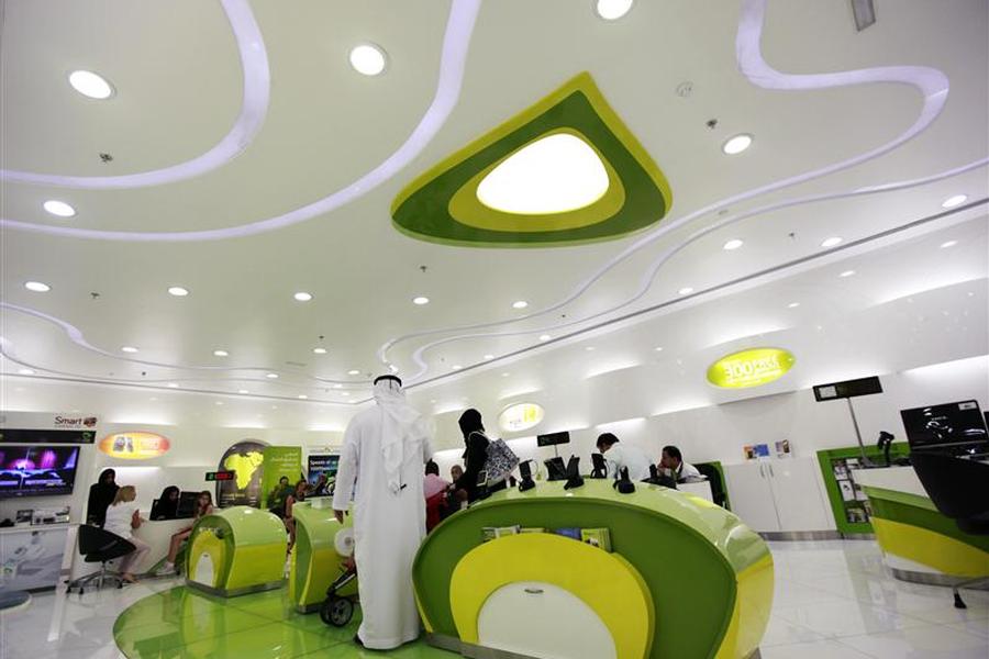 Customers wait inside an Etisalat store at a shopping mall in Dubai
                                
                  Reuters  Jumana El Heloueh