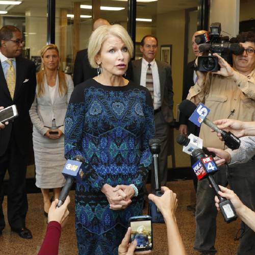 Dallas County District Attorney Susan Hawk holds a press conference outside of her office at the Frank Crowley Courts building in Dallas. Hawk who has spoken publicly about her battles with depression and