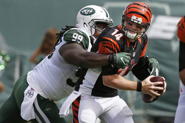 ASSOCIATED PRESS           New York Jets defensive tackle Steve Mc Lendon sacks Cincinnati Bengals’ Andy Dalton during the first half of an NFL football game Sunday Sept. 11 2016 in East Rutherford N.J