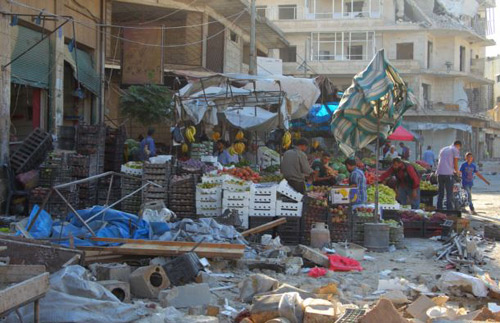 Damage is seen near produce stands after airstrikes on a market in the rebel-controlled city of Idlib Syria on Sept. 10 2016. /Reuters