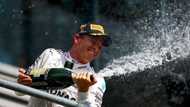 Nico Rosberg of Germany and Mercedes GP celebrates on the podium during the Formula One Grand Prix of Belgium