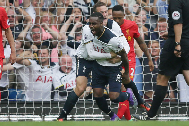 Tottenham's Danny Rose celebrates with his teammate Vincent Janssen after scoring a goal during the English Premier League soccer match between Tottenham Hotspur and Liverpool at White Hart Lane in London on Saturday